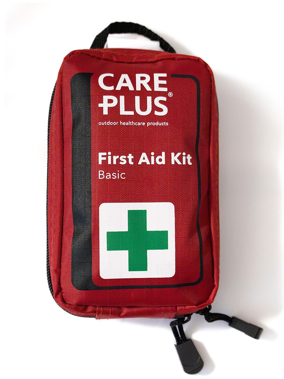 A red zippered pouch labeled First Aid Kit with a green cross, for storm prep in Panama City, FL